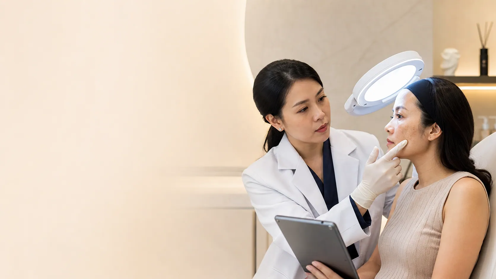 Doctor assessing symmetrical facial melasma before treatment in Johor Bahru